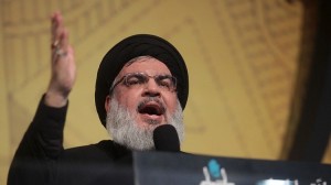 Lebanon's Hezbollah leader Sayyed Hassan Nasrallah gestures as he addresses his supporters during a rare public appearance at an Ashura ceremony in Beirut's southern suburbs, Lebanon